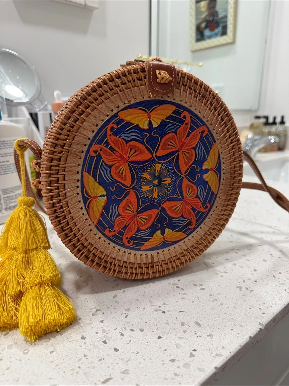 Round Woven Raffia Crossbody Bag with Blue & Orange Butterfly Motif